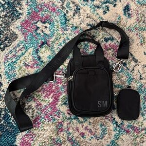 Steve Madden SM crossbody bag in black nylon with detachable AirPod case